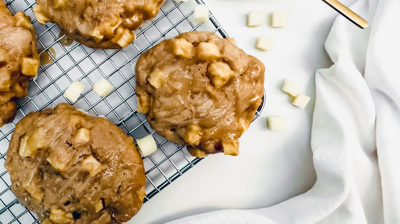 fritters with chopped apples on wire rack