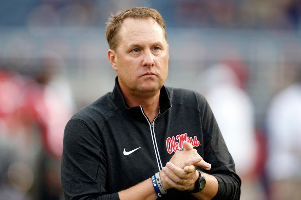 FILE - In this Oct. 24, 2015, file photo, Mississippi football coach Hugh Freeze watches his team warmup before an NCAA college football game against Texas A&M in Oxford, Miss. USA Today reported July 25, 2017, that a charity foundation founded by Freeze is taking a break from fundraising and will reconsider its future days after the coach resigned amid what the school called a "pattern of personal misconduct." (AP Photo/Rogelio V. Solis, File)