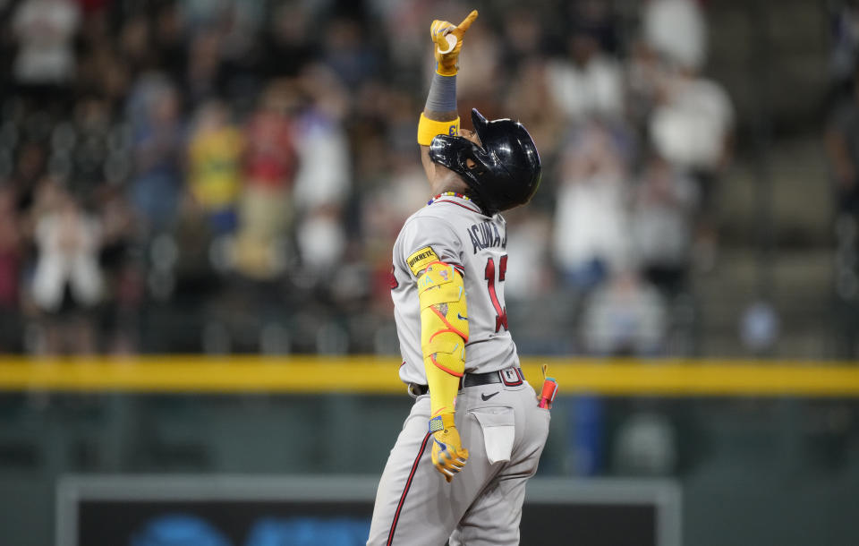 Atlanta Braves' Ronald Acuna Jr. gestures after reaching second base on his double off Colorado Rockies relief pitcher Daniel Bard which drove in three runs against in the ninth inning of a baseball game Monday, Aug. 28, 2023, in Denver. (AP Photo/David Zalubowski)