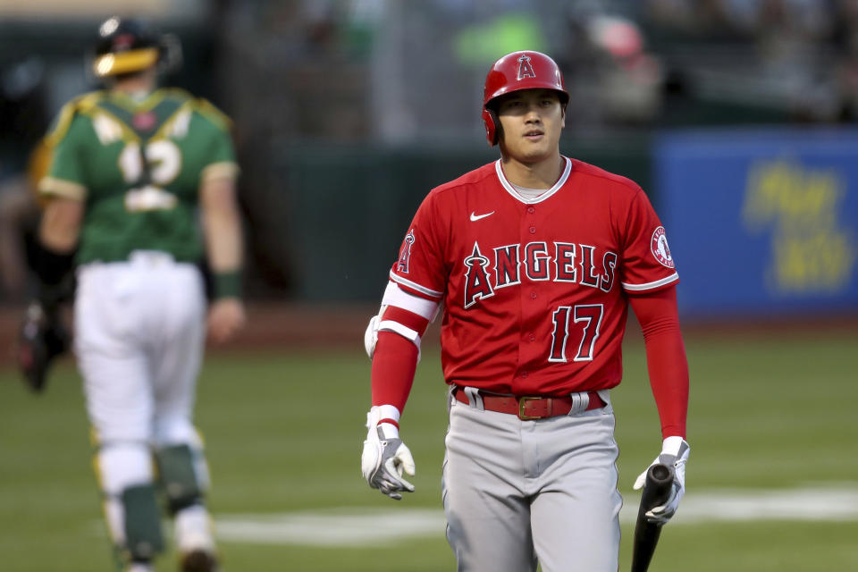 Los Angeles Angels' Shohei Ohtani walks back to the dugout after striking out against the Oakland Athletics during the fifth inning of a baseball game in Oakland, Calif., Tuesday, June 15, 2021. (AP Photo/Jed Jacobsohn)
