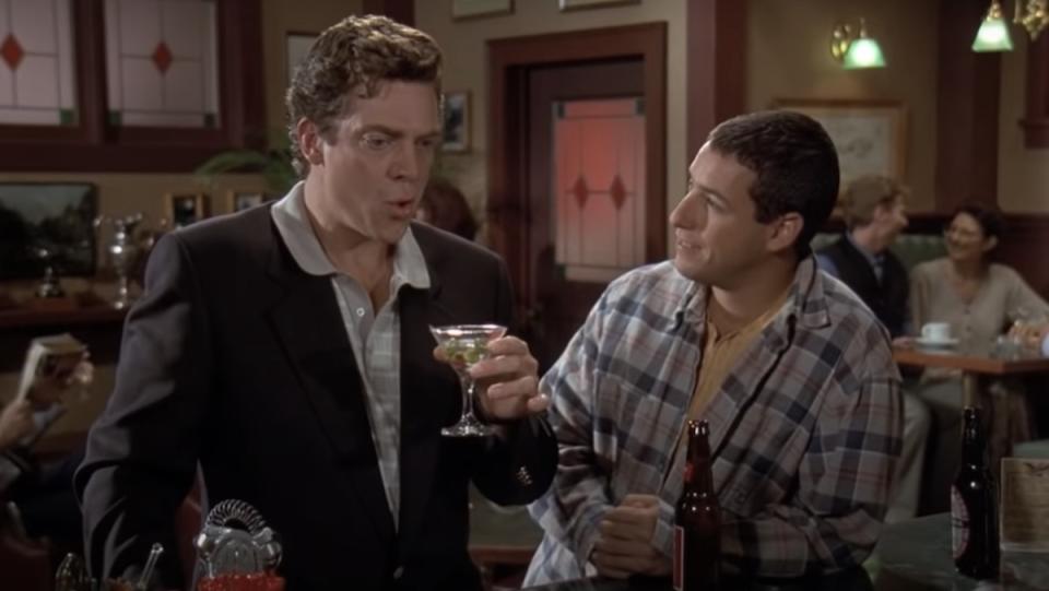 Shooter mcGavin with a martini at a bar while Happy Gilmore stares at him while holding a beerr