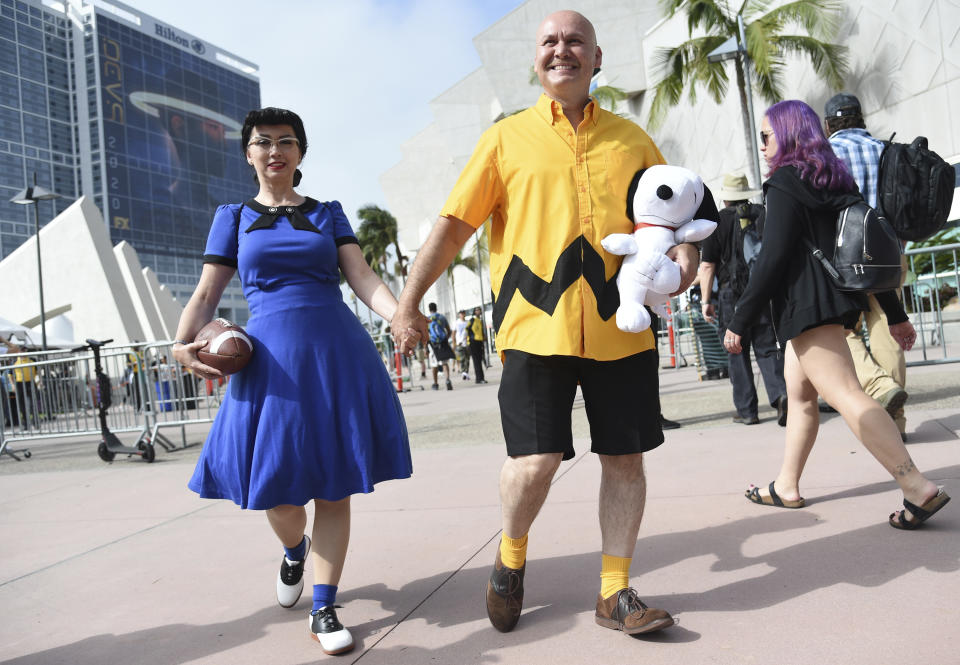 Lucy Capuchino, left, and Miguel Capuchino, of San Diego, dressed as Lucy and Charlie Brown, attend day one of Comic-Con International on Thursday, July 18, 2019, in San Diego. (Photo by Chris Pizzello/Invision/AP)