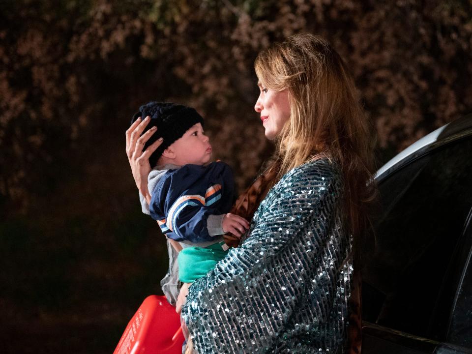 Dottie Quinn holding baby Henry on season 3 of "You"