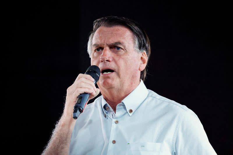 FILE PHOTO: Former Brazilian President Jair Bolsonaro attends an event taking place in a restaurant at Dezerland amusement park in Orlando