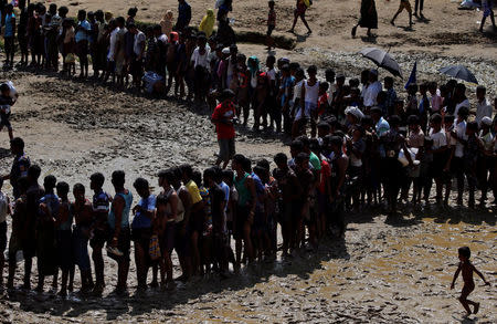 Rohingya refugees queue for aid in Cox's Bazar, Bangladesh, September 21, 2017. REUTERS/Cathal McNaughton