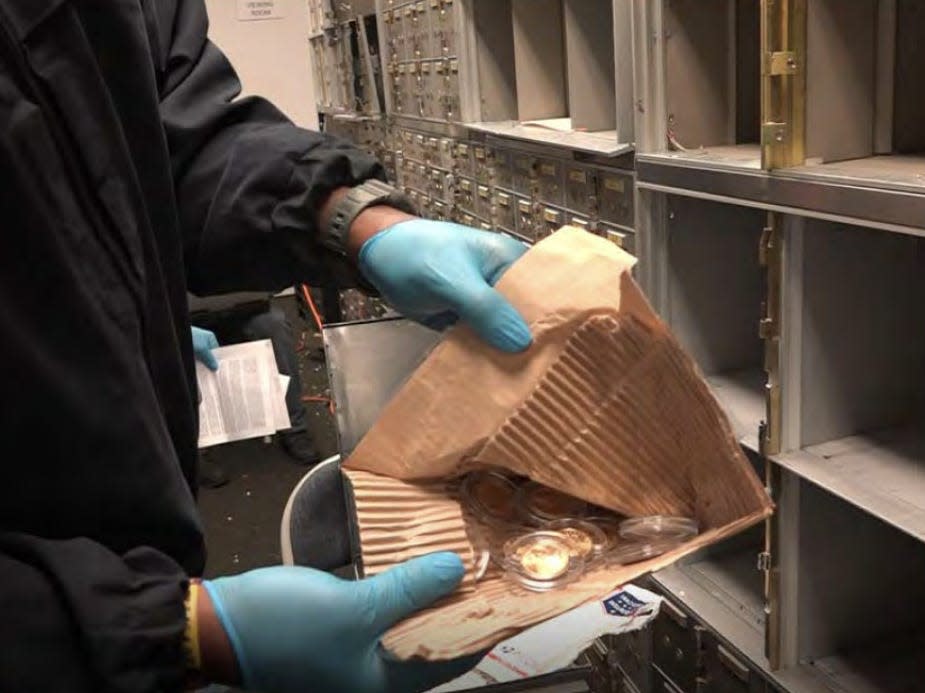 FBI agents search safe-deposit boxes at the US Private Vaults store in Beverly Hills in this video screen capture taken from a US District Court document.