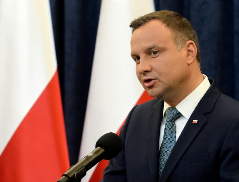 President Andrzej Duda defiantly signed into law two hotly contested judicial reforms just hours after the EU censure process was launched