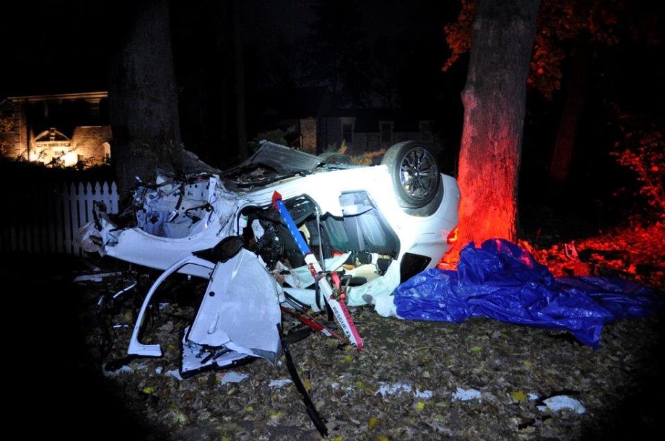 This is the crash scene from Nov. 17, 2023, when a teenage Grosse Pointe driver lost control of a BMW at 105 mph on a residential street, killing his passenger: Flynn MacKrell, 18, a freshman at the University of Dayton who was home for Thanksgiving break. The driver, 17, was charged with second-degree murder, though the victim's family also wants his mother charged, alleging she knew her son was a dangerous driver but never took away his keys.