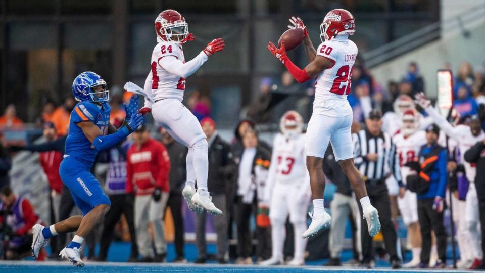 Fresno State defensive back Cam Lockridge intercepts a pass that sails over the head of Boise State wide reveiver Billy Bowens in the second half of the Mountain West Championship, Saturday, Dec. 3, 2022, at Albertsons Stadium in Boise.
