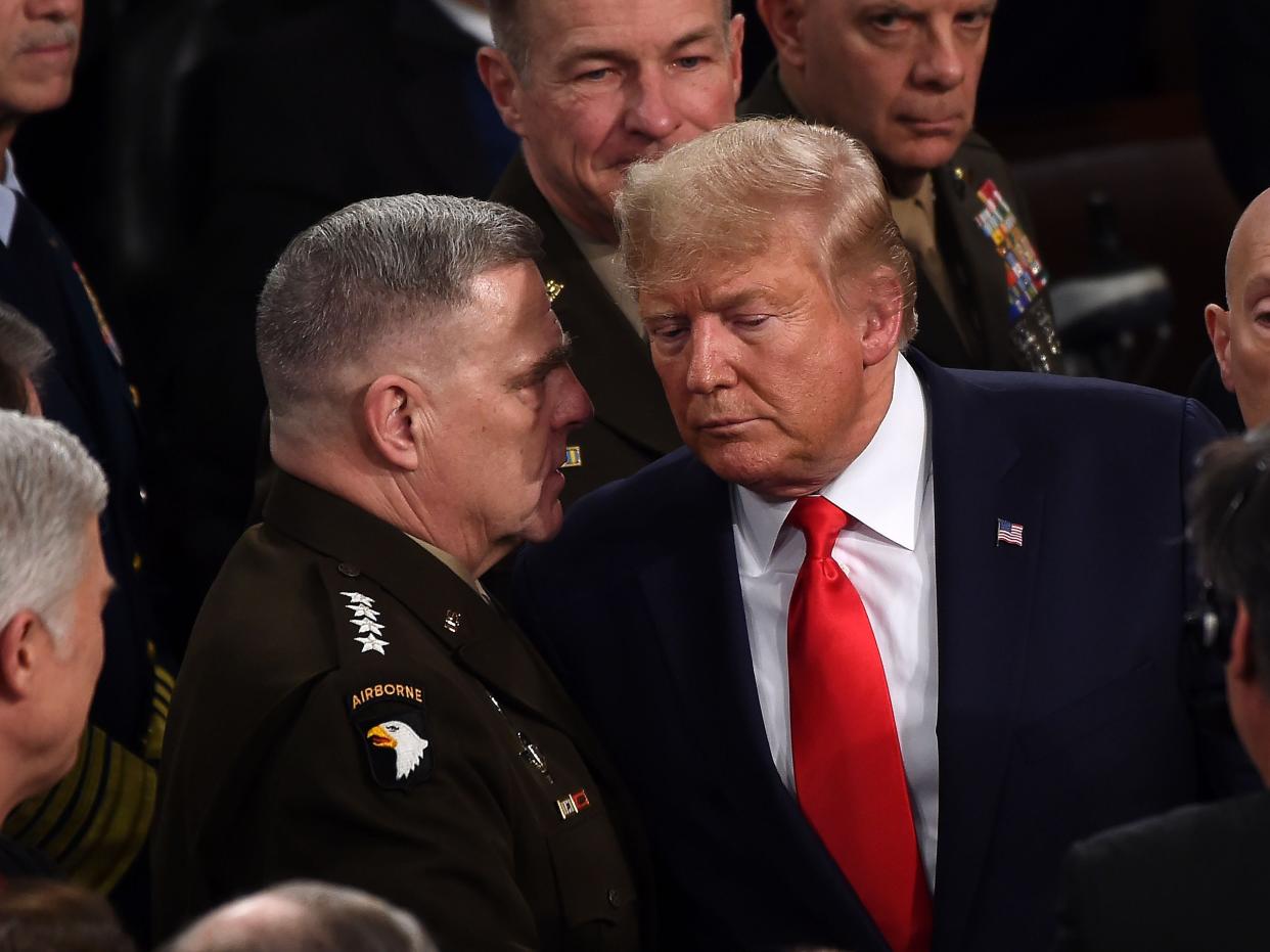 Chairman of the Joint Chiefs of Staff Gen. Mark Milley chats with US President Donald Trump after he delivered the State of the Union address at the US Capitol in Washington, DC, on February 4, 2020 (AFP via Getty Images)