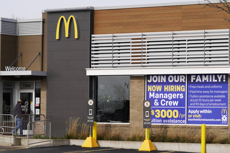 FILE - In this Nov. 19, 2020, file photo, a hiring sign is displayed outside of McDonald's in Buffalo Grove, Ill. On Wednesday, April 14, 2021, McDonald’s said the company will mandate worker training to combat harassment, discrimination and violence in its restaurants worldwide starting in 2022. (AP Photo/Nam Y. Huh, File)