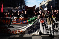 Protesters shout during a demonstration Thursday, Jan. 16, 2020 in Paris. Protesters denounce French President Emmanuel Macron's plans to overhaul the pension system. (AP Photo/Kamil Zihnioglu)