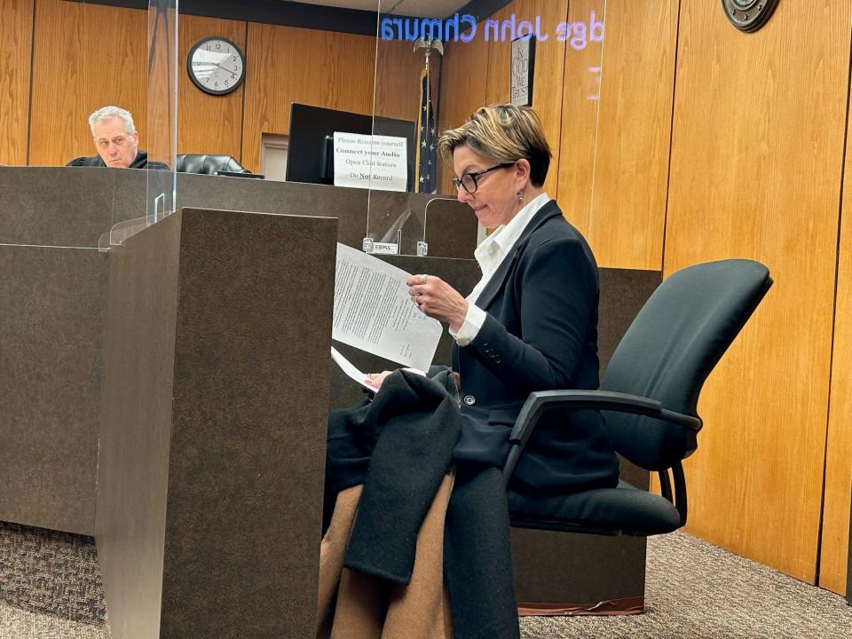Donna Brandenburg reviews a contract Jan. 10, 2024, in 37th District Court in Warren. She tried to run for governor in 2022 but was disqualified after fraudulent nominating petition signatures were discovered. Shawn and Jamie Wilmoth and Willie Reed are charged with fraud and appeared for their preliminary exams.