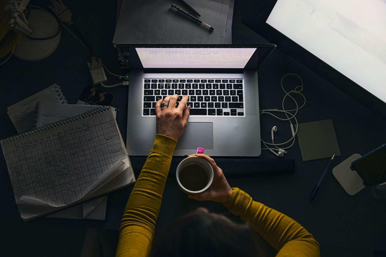 <p>Getty</p> Stock image of a woman working at night