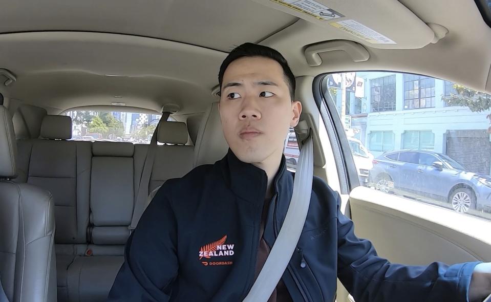 Andy Fang, DoorDash’s co-founder and chief technology officer, picks up and delivers food orders to customers in downtown San Francisco on Saturday, June 15, 2023. Fang is one of a growing number of executives who work shifts on the front lines of the companies they run. All DoorDash salaried employees are required to make deliveries or work directly with customers or merchants several times a year. (AP Photo/Terry Chea)