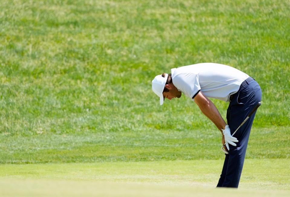 Scottie Scheffler reacts after hitting his second shot into the bunker on the 17th hole of the final round of the Memorial Tournament in 2023. Last week's PGA Championship was a trying one for the reigning Masters champion after he was arrested Friday morning and then fell out of contention with a rough round Saturday.