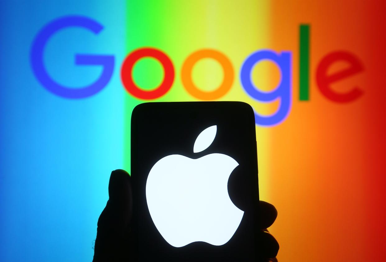 Apple logo on a phone in front of a Google logo with the colours of the rainbow