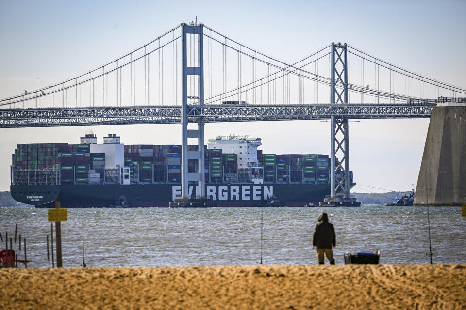 Evergreen Marine's Ever Forward container ship passes under the Chesapeake Bay Bridge after it was freed from mud outside the shipping channel off Pasadena, Md., where is had spent the past month aground. It was being taken to an anchorage south of Annapolis where the hull will be inspected for damage. (Jerry Jackson/The Baltimore Sun via AP)