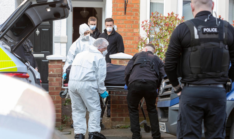 Nicholas Billingham’s body is removed from the property after it was discovered by police. (SWNS)