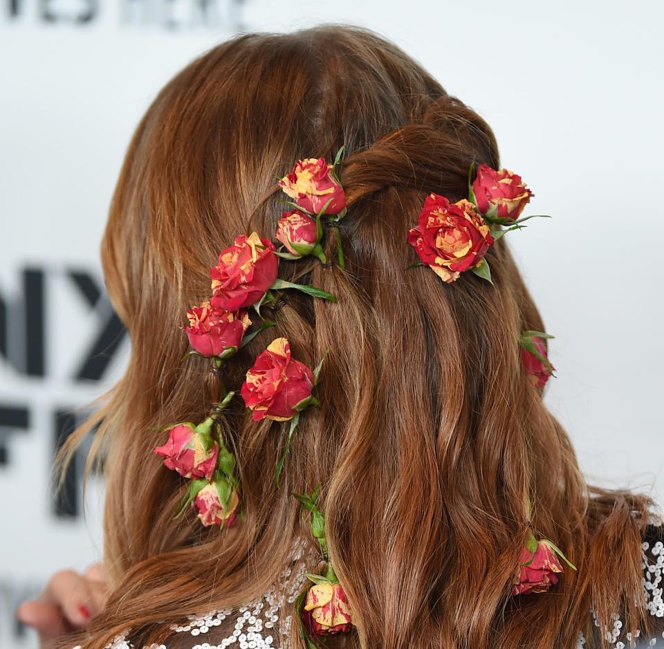 Emma Stone wore a bouquet of roses in her hair for the latest red carpet appearance, and it was gorgeous, naturally. See the look here, and swoon.