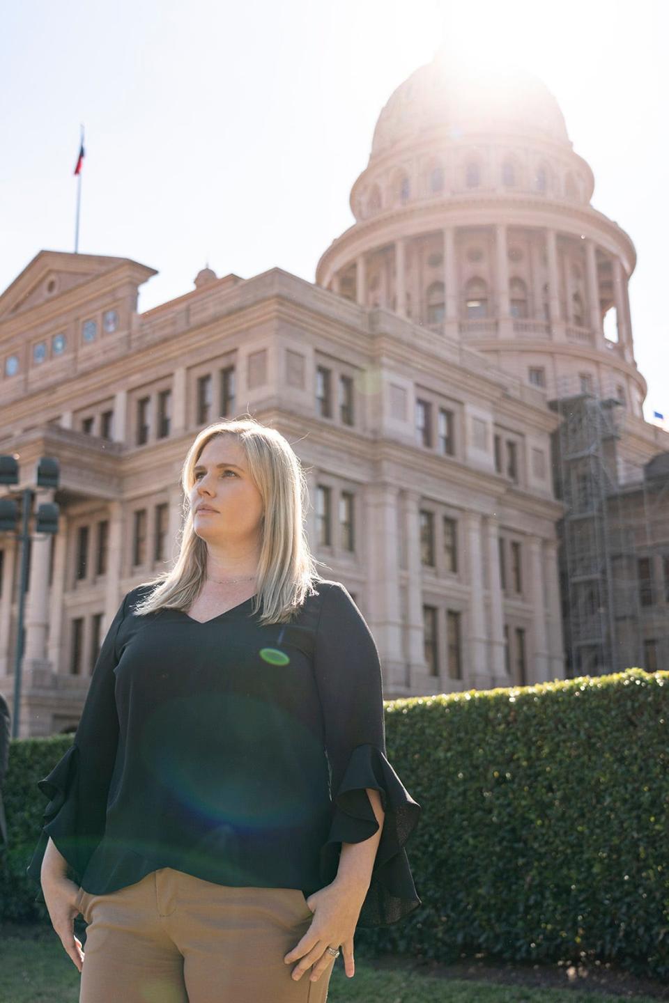 Plaintiff Kaitlyn Kash stands in front of the Texas Capitol after the Texas Supreme Court heard oral arguments for Zurawski v. State of Texas Tuesday, Nov. 28, 2023. The The plaintiffs, 20 women who were denied abortions despite severe pregnancy complications and two OB-GYNs suing on behalf of their patients, are demanding that the state clarify medical exceptions to its near-total abortion ban.