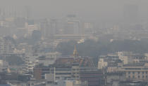 A thick layer of smog covers central Bangkok, Thailand, Monday, Jan. 20, 2020. Thick haze blanketed the Thai capital on Monday sending air pollution levels soaring to 89 micrograms per cubic meter of PM2.5 particles in some areas, according to the Pollution Control Department. (AP Photo/Sakchai Lalit)