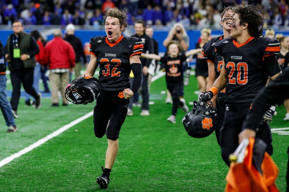 Hudson running back Bronson Marry celebrates the 14-7 win in the Division 8 state final on Friday, Nov. 26, 2021, at Ford Field.