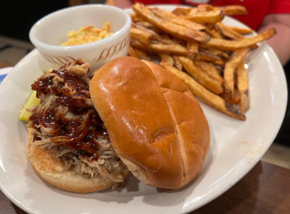 Leather Helmet Grill is a new downtown Canton eatery located next to the Palace Theatre. Menu items include a pulled pork sandwich with house barbecue sauce.