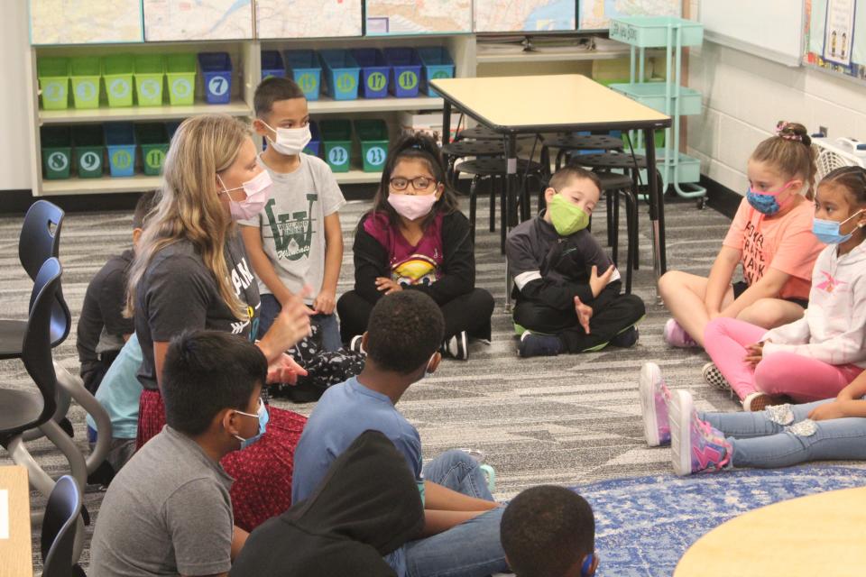 Students at Pine Creek Elementary listen to their teacher on the first day of school during the 2021-22 school year.