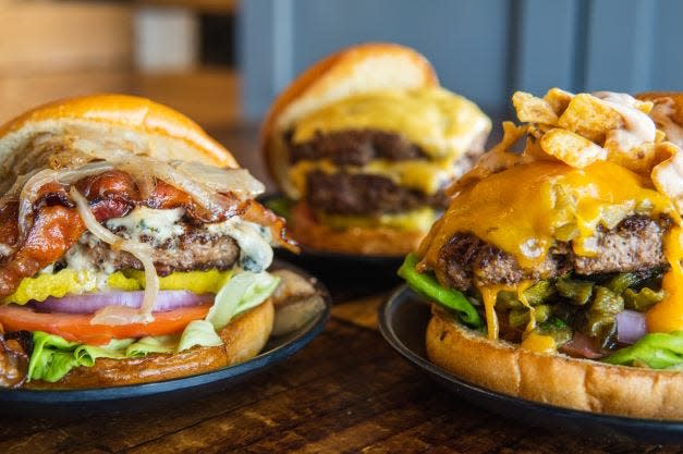 Left to right: Kona Blue, Double Cheeseburger and the Down the Hatch burgers at Food + Beer.