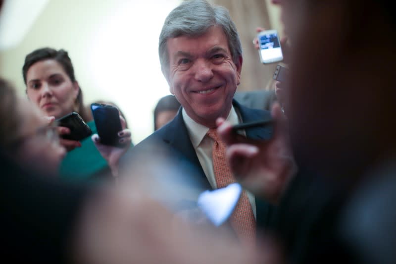 U.S. Senator Blunt talks to reporters as he departs after the weekly Republican caucus luncheon at the U.S. Capitol in Washington