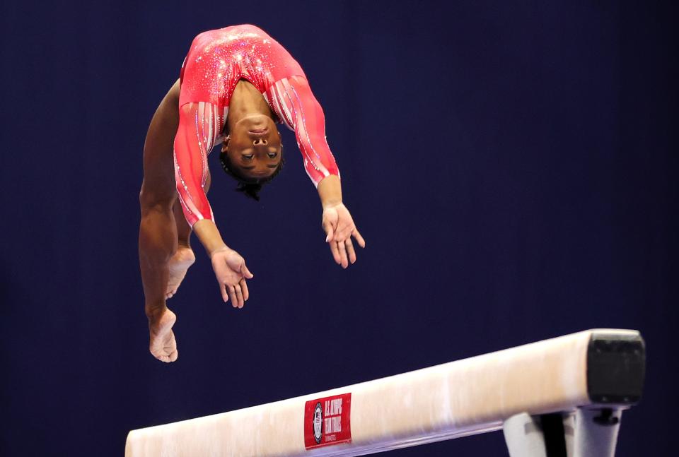 Simone Biles competes on the balance beam during the 2021 U.S. Gymnastics Olympic Trials at The Dome at America’s Center on June 27, 2021, in St Louis, Missouri.