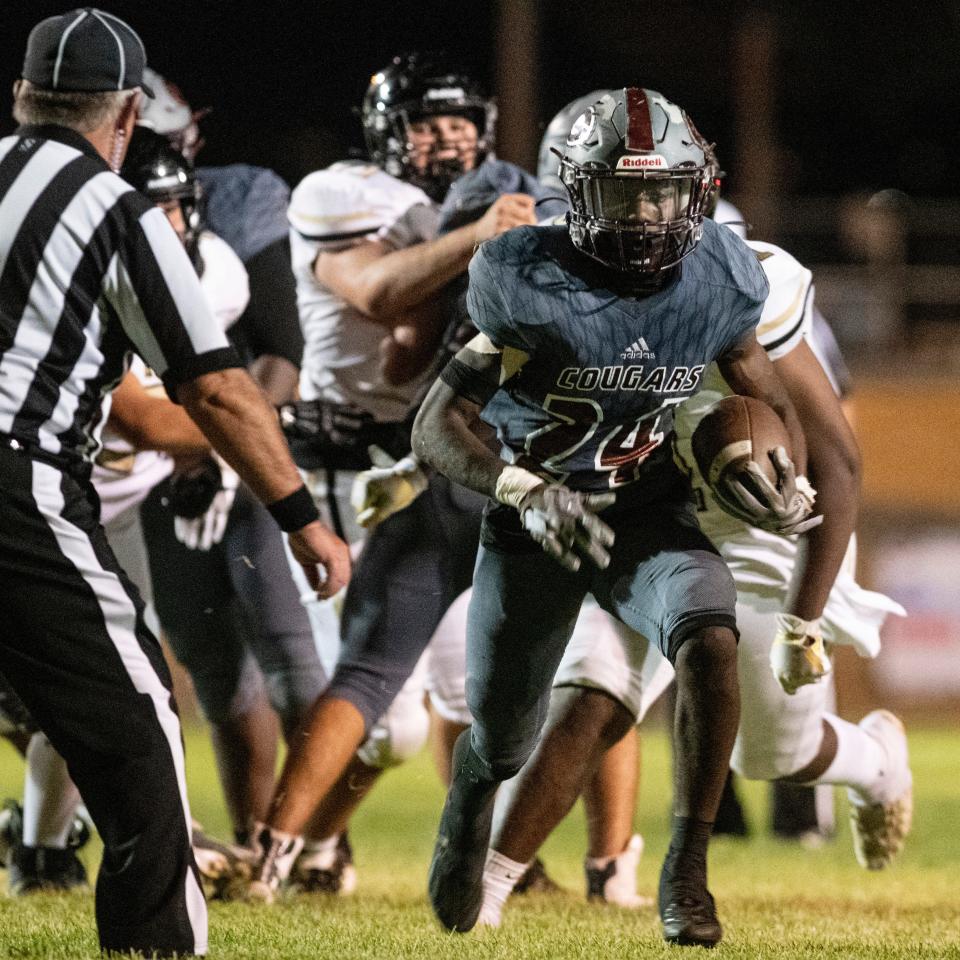 Granite Hills’ Kameron Smith breaks free for a touchdown against Hesperia on Friday, Sept. 23, 2022. The Cougars won 56-42.