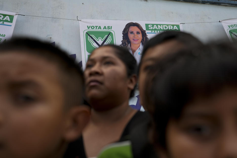 Supporters wait for the arrival of National Unity of Hope party presidential candidate Sandra Torres before the start of her campaign rally in San Juan Sacatepequez, Guatemala, Sunday, Aug. 6, 2023. In her third bid for the presidency, the former first lady has drafted an evangelical pastor as her running mate and is leaning heavily on her firm commitments to keeping abortion and same-sex marriages illegal in Guatemala. (AP Photo/Moises Castillo)