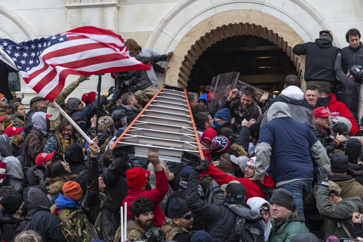 Pro-Trump rioters clash with police outside the U.S. Capitol on Jan. 6. (Photo by Lev Radin/Pacific Press/LightRocket via Getty Images)