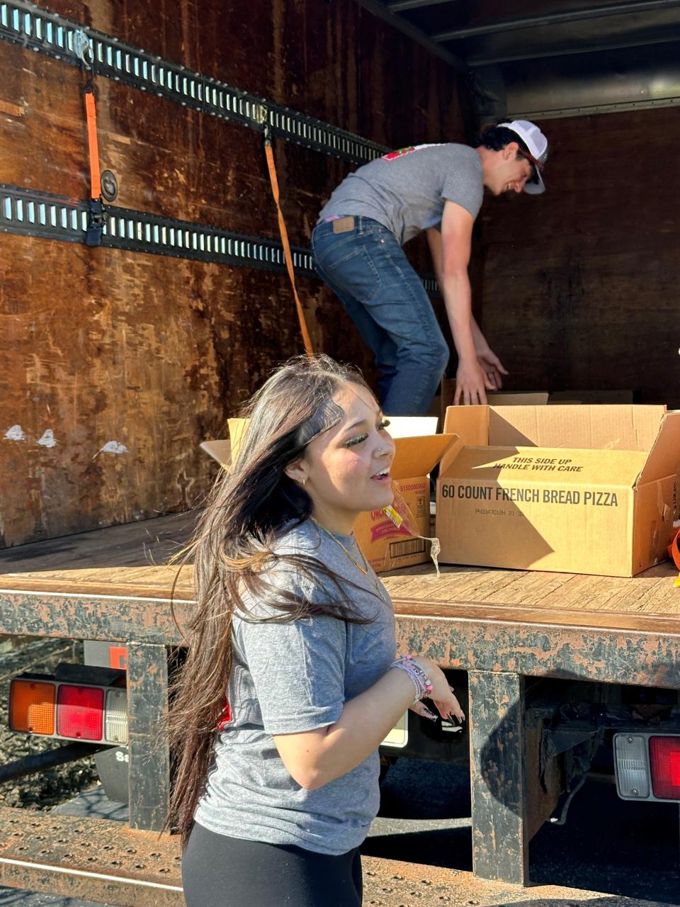 Vineland residents Aiyana Mendez and Dominic Mercado, sophomores at Cumberland County Technical Education Center, load food for delivery to Spirit & Truth Ministries in Vineland. Dom's Pasta Party is an annual food drive for its soup kitchen. PHOTO: April 15, 2024.