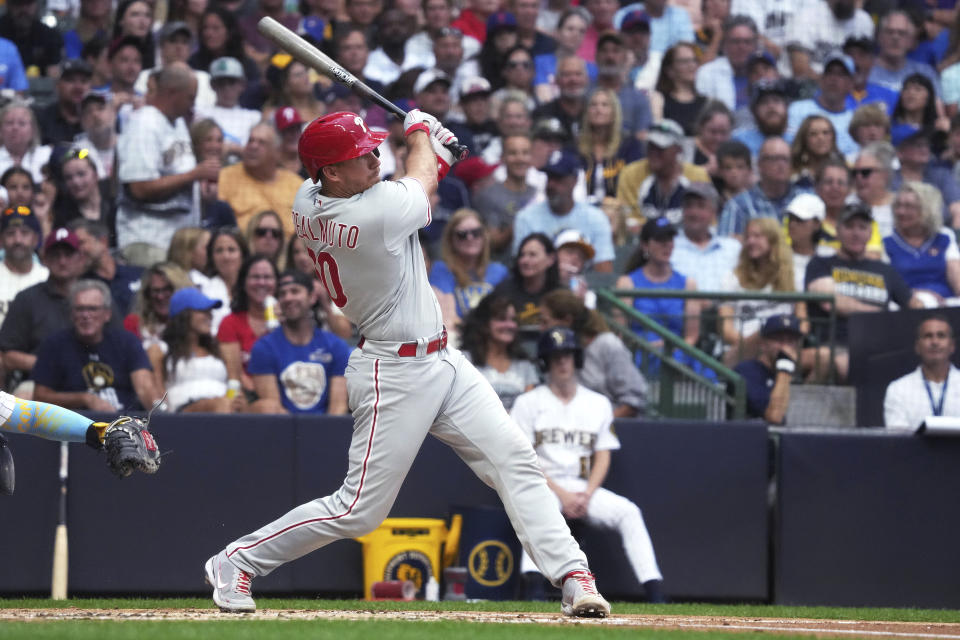 Philadelphia Phillies' J.T. Realmuto follows through on a home run against the Milwaukee Brewers during the second inning of a baseball game Saturday, Sept. 2, 2023, in Milwaukee. (AP Photo/Kayla Wolf)