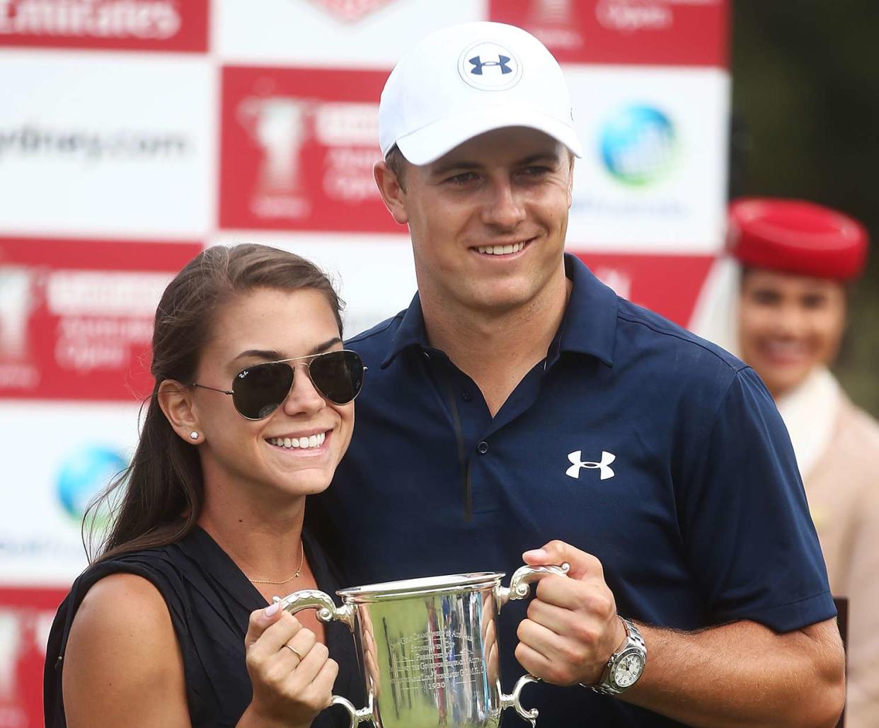 Jordan Spieth of the United States and girlfriend Annie Verret pose with the Stonehaven trophy after winning the 2016 Australian Open during day four of the 2016 Australian golf Open at Royal Sydney Golf Club on November 20, 2016 in Sydney, Australia