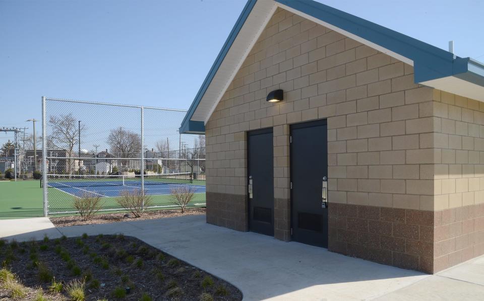 Restroom facilities are centrally located among the tennis and pickleball courts at Cairns Park.