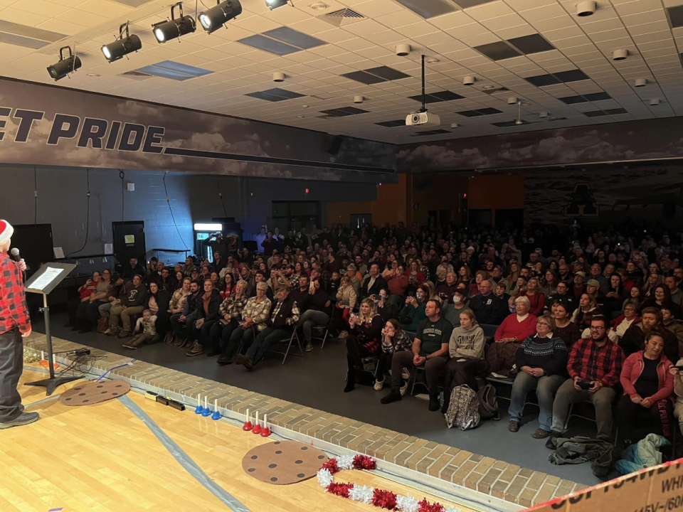 An Airport elementary school concert, held in Airport High School's cafeteria, is shown with an over-capacity crowd. The district is proposing to build a performing arts center that would seat up to 650 people and could also be used by community organizations.