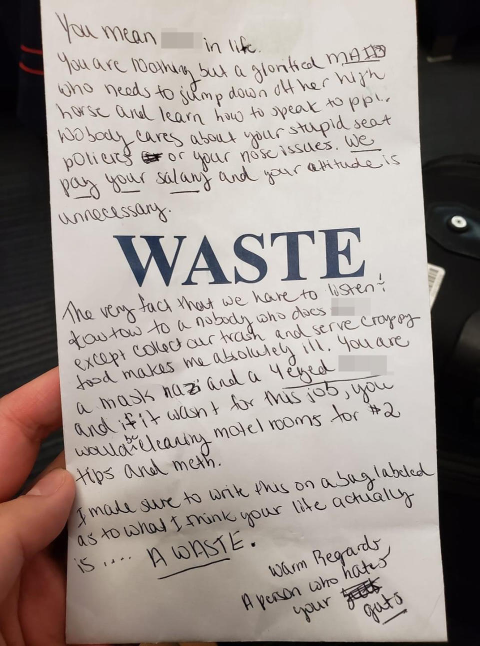 A disgruntled passenger's note to an airline steward is pictured after they were asked to wear a face mask.