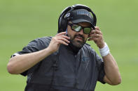 Carolina Panthers head coach Matt Rhule adjusts his headset during the second half of an NFL football game against the Tampa Bay Buccaneers Sunday, Sept. 20, 2020, in Tampa, Fla. (AP Photo/Jason Behnken)