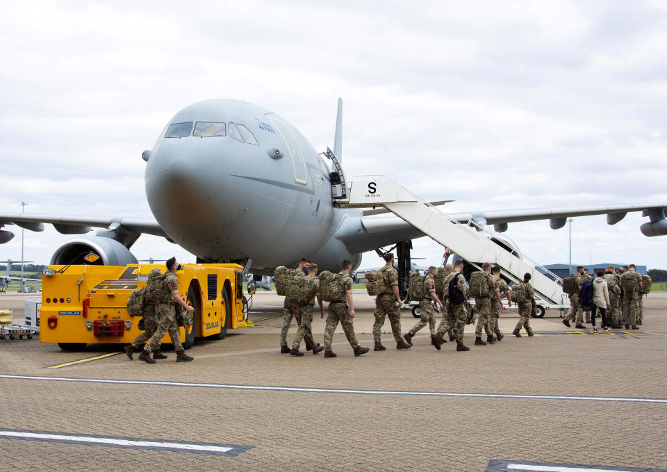 In the photo provided by the Ministry of Defence, UK military personnel board an RAF Voyager aircraft at RAF Brize Norton, England on Aug. 14, 2021 to travel to Afghanistan. Additional UK military personnel will deploy to Afghanistan on a short-term basis to provide support to British nationals leaving the country, the Defence Secretary has announced. (Mrs Sharron Flyod/Ministry of Defence via AP)