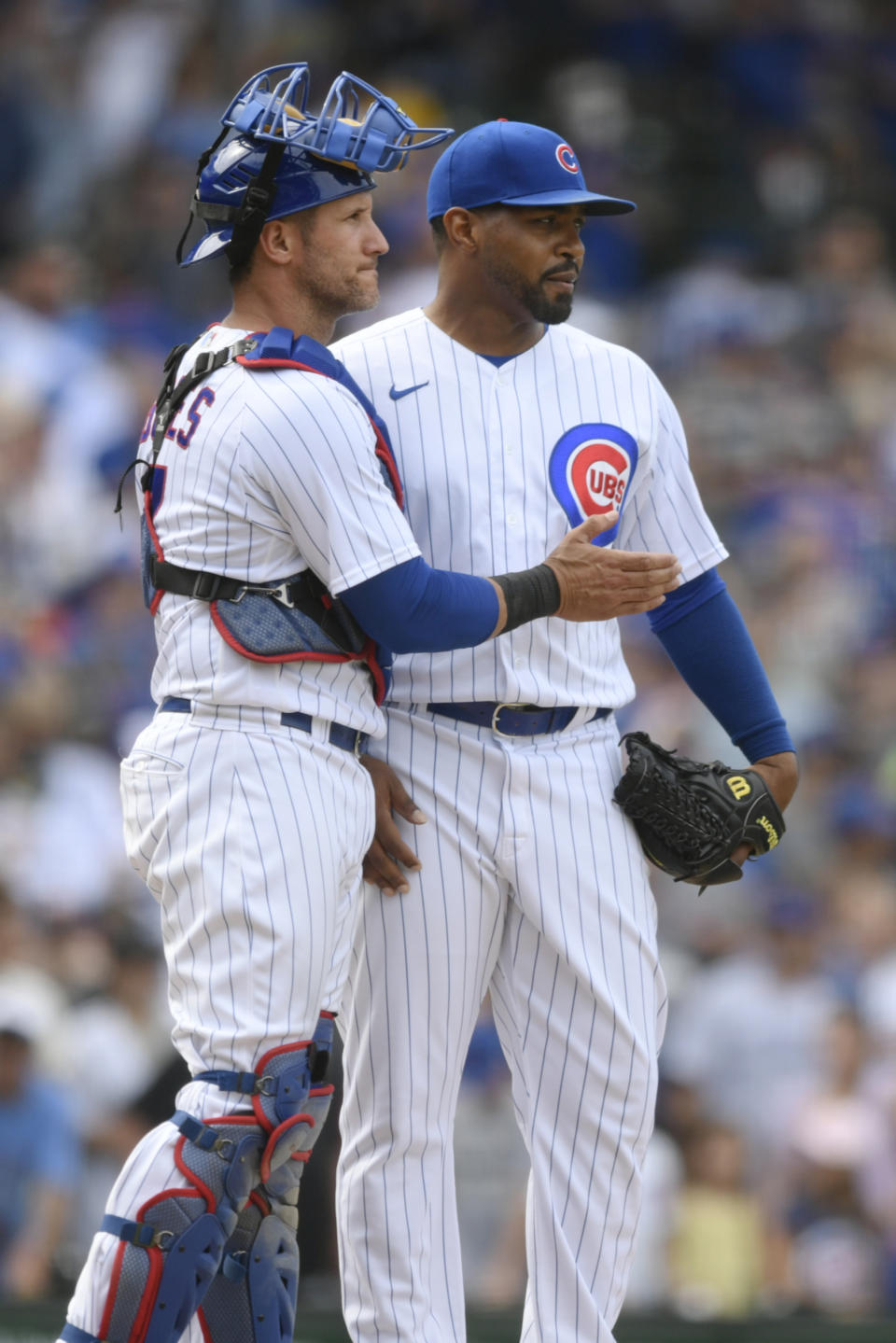 Chicago Cubs closing pitcher Mychal Givens, right, celebrates with catcher Yan Gomes, left, after defeating the Pittsburgh Pirates 4-2 in a baseball game Tuesday, July 26, 2022, in Chicago. (AP Photo/Paul Beaty)
