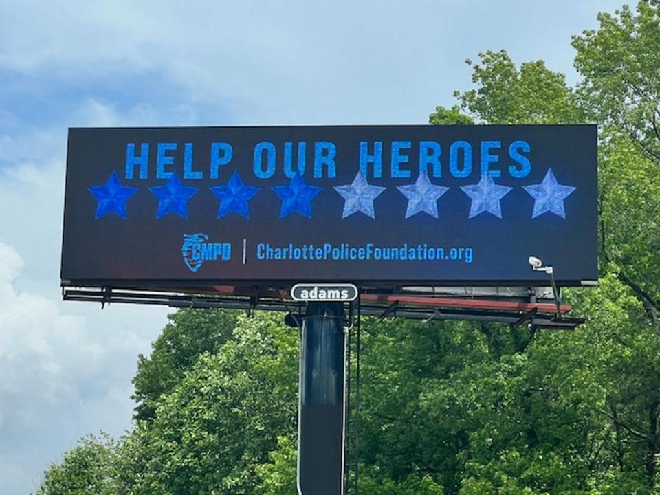 Adams Outdoor Advertising had put up billboards throughout Charlotte that read “Help Our Heroes” with four dark blue and four light blue stars representing the eight officers killed and wounded while serving a warrant on Monday. Hood Hargett Breakfast Club