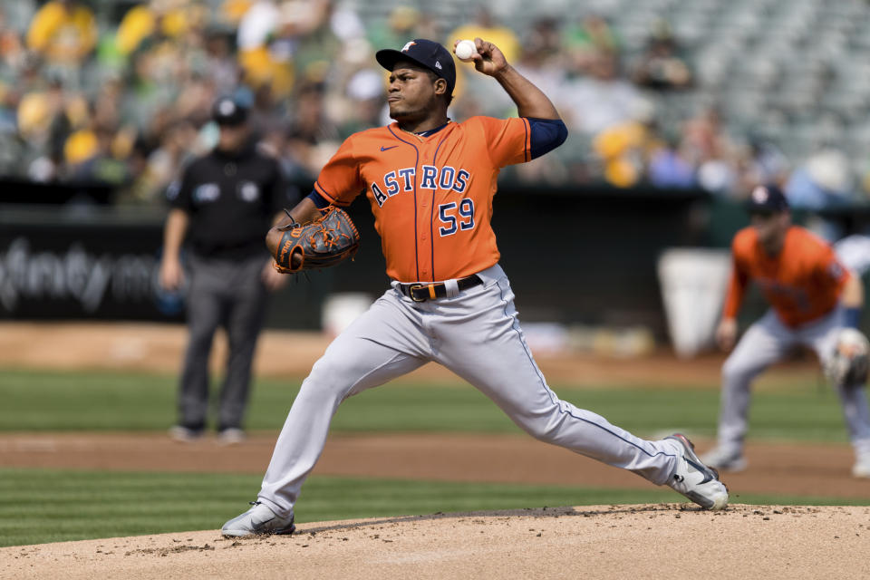 Houston Astros starting pitcher Framber Valdez works against the Oakland Athletics in the first inning of a baseball game in Oakland, Calif., Saturday, Sept. 25, 2021. (AP Photo/John Hefti)