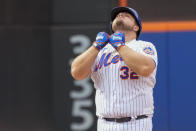 New York Mets' Daniel Vogelbach reacts after hitting an RBI double during the seventh inning of a baseball game against the Cincinnati Reds, Sunday, Sept. 17, 2023, in New York. (AP Photo/Mary Altaffer)