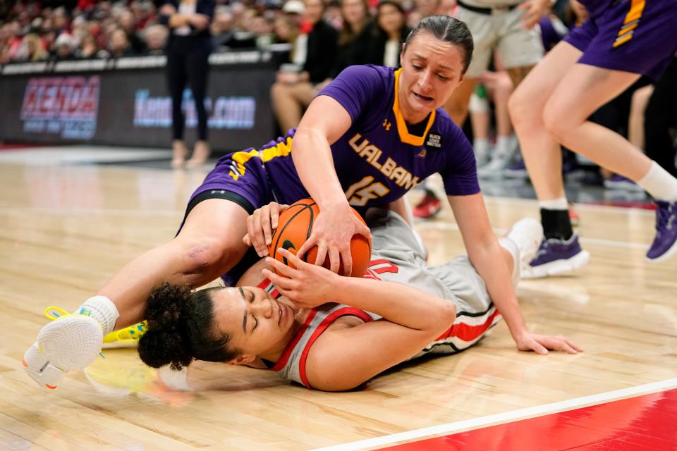 Ohio State's Madison Greene, here grabbing a loose ball under Albany guard Morgan Haney, has averaged 9.8 points, 3.5 assists, 2.6 rebounds and 1.6 steals a game in her career.