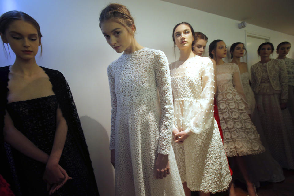 Models wait backstage prior to the Valentino Spring Summer 2013 Haute Couture fashion collection, presented in Paris, Wednesday, Jan. 23, 2013. (AP Photo/Christophe Ena)