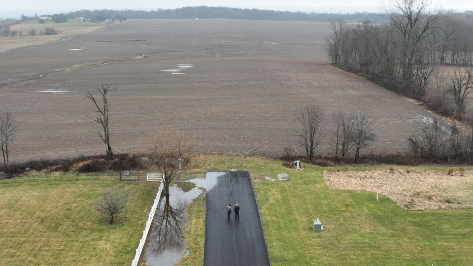 Kerry Hamilton (left) and Judd Templin are homeowners in the Grand Pointe neighborhood trying to permanently close about 200 feet of Grand Pointe Drive to stop it from being an access road to a possible huge development on farmland east of the community.